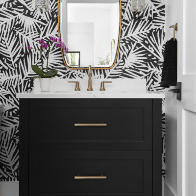 black-and-white-bathroom-bold-wallpaper-brushed-gold-accent-black-cabinet-guest-bath