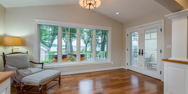 clean-modern-guest-bedroom-natural-light-french-doors-white