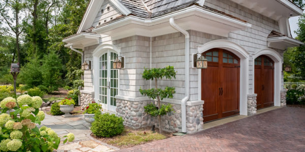 garage-exterior-stone-shingles-square-lighting-brick-driveway