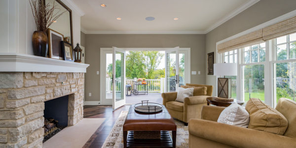 great-room-french-doors-stone-fireplace-natural-light