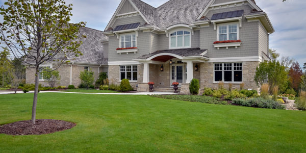 landscaping-exterior-elevation-tan-white-stone-home