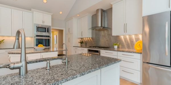 modern-white-kitchen-stainless-steel-appliances-subway-tile-backsplash