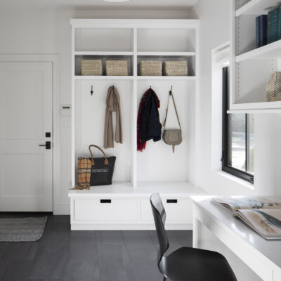 mudroom-storage-utility-room-black-flooring-white-cabinets-built-in-desk