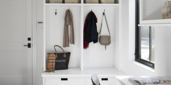 mudroom-storage-utility-room-black-flooring-white-cabinets-built-in-desk