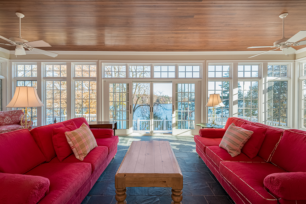 lake-house-historic-charm-luxury-cottage-sunroom-wood-planks-ceiling