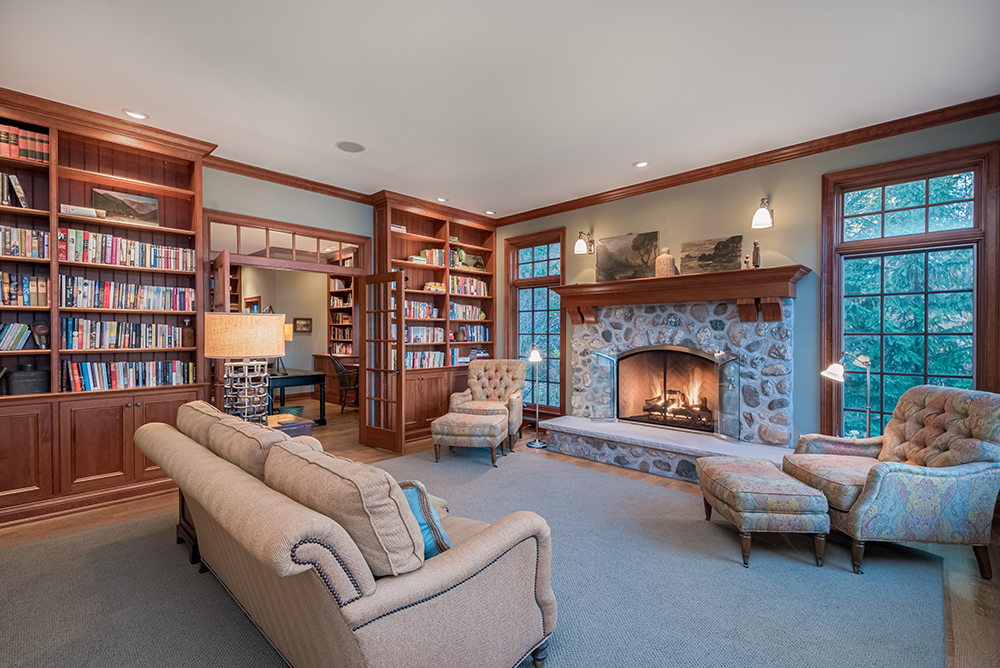 lake-house-new-construction-historic-1900s-charm-great-room-stone-fireplace